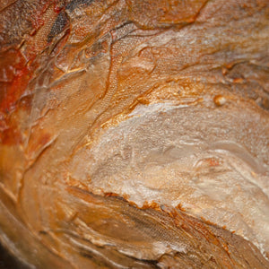 Abstraktes Kunstbild mit fließendem Wirbelmuster in warmen Terrakottafarben